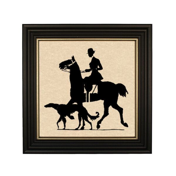 Silhouettes Equestrian Woman Rider with Dog Framed Paper Cut Silhouette in Black Wood Frame with Gold Trim. An 8 x 8″ framed to 10 x 10″.