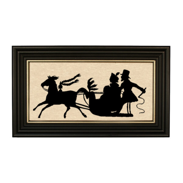 Silhouettes Christmas Dashing Through the Snow Framed Paper Cut Silhouette in Black Wood Frame with Gold Trim. A 5″ x 10″ framed to 7″ x 12″.