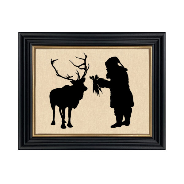 Silhouettes Christmas Santa Feeding Reindeer Framed Paper Cut Silhouette in Black Wood Frame with Gold Trim. An 8 x 10″ framed to 10 x 12″.