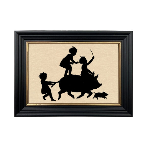 Early American Animals Children Riding Pig Framed Paper Cut Silhouette in Black Wood Frame with Gold Trim. An 6-3/4 x 10″ framed to 8-3/4 x 12″.